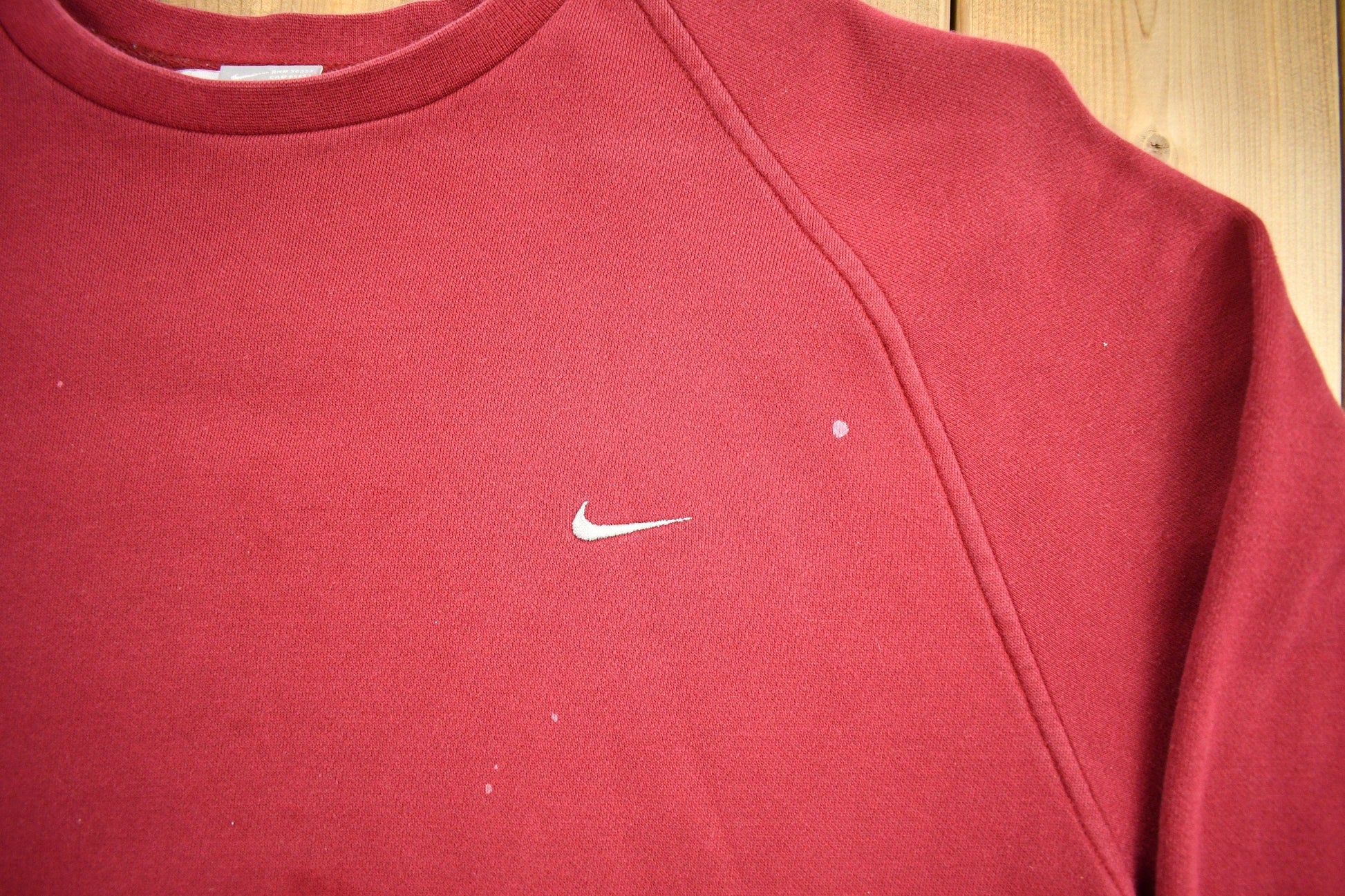 Vintage Nike Embroidered Mini Swoosh Raglan Crewneck Sweatshirt Men's 2XL from propervintagecanada