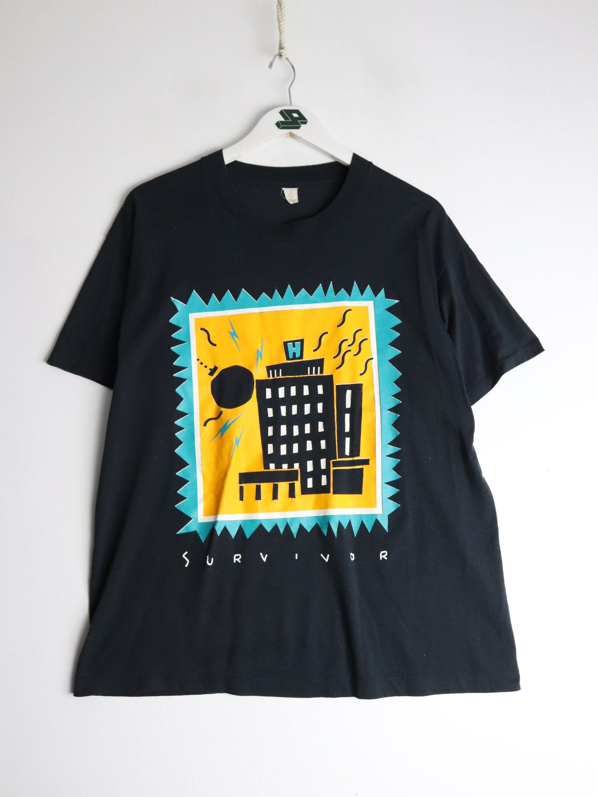 Vintage St. Catherines Redevelopment T Shirt Fits Mens Large Black 90s from propervintagecanada