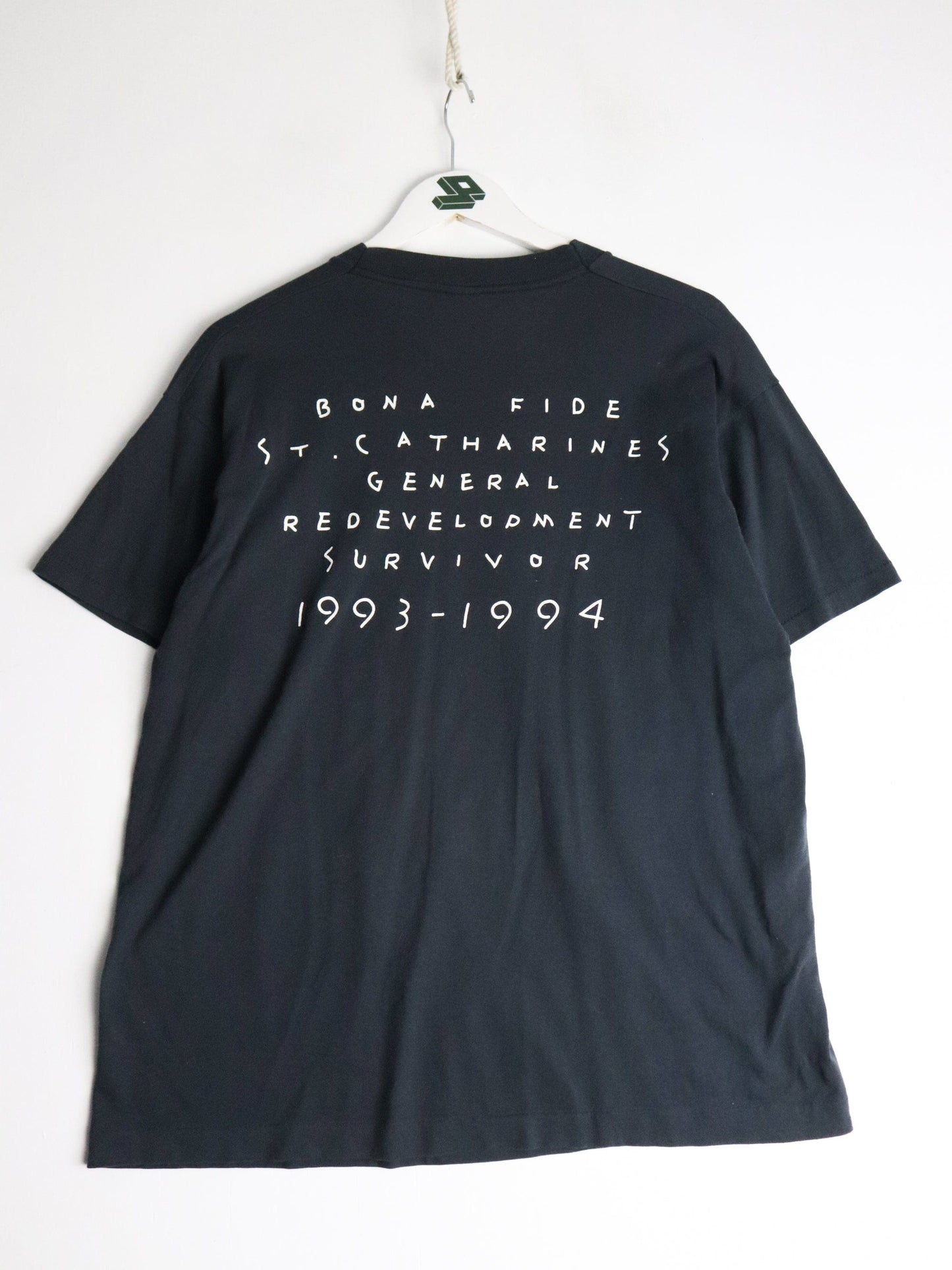 Vintage St. Catherines Redevelopment T Shirt Fits Mens Large Black 90s from propervintagecanada