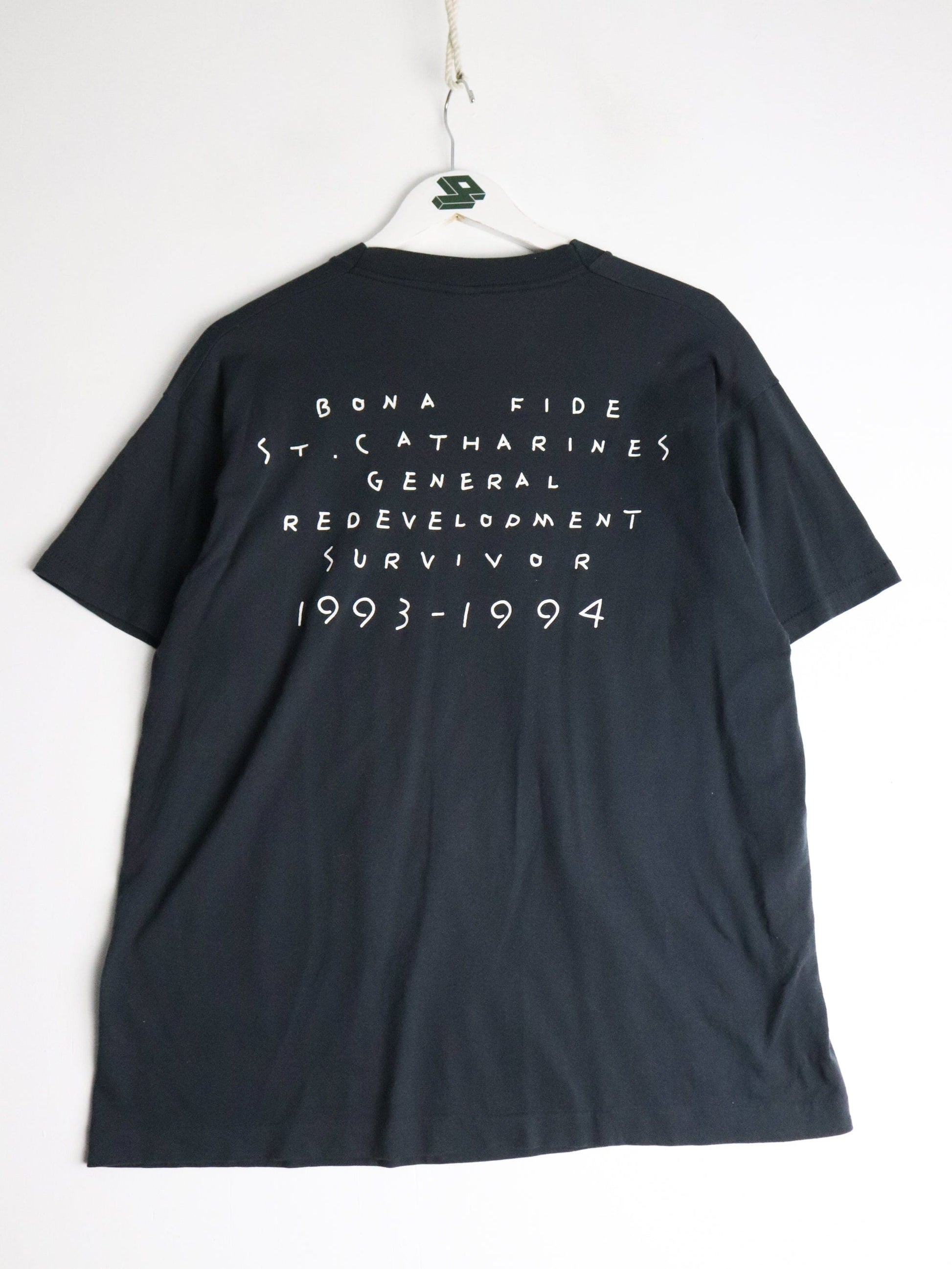 Vintage St. Catherines Redevelopment T Shirt Fits Mens Large Black 90s from propervintagecanada