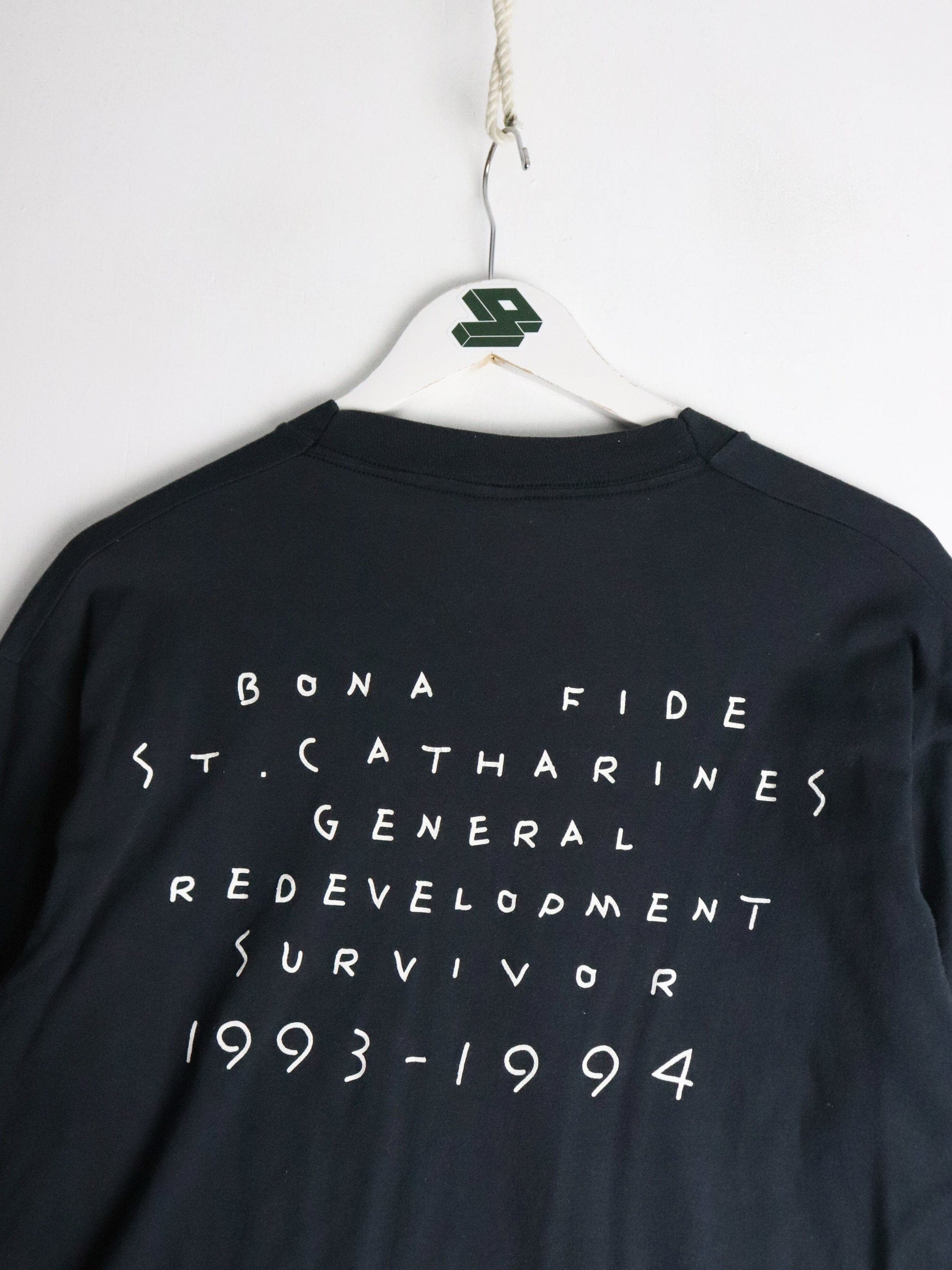 Vintage St. Catherines Redevelopment T Shirt Fits Mens Large Black 90s from propervintagecanada