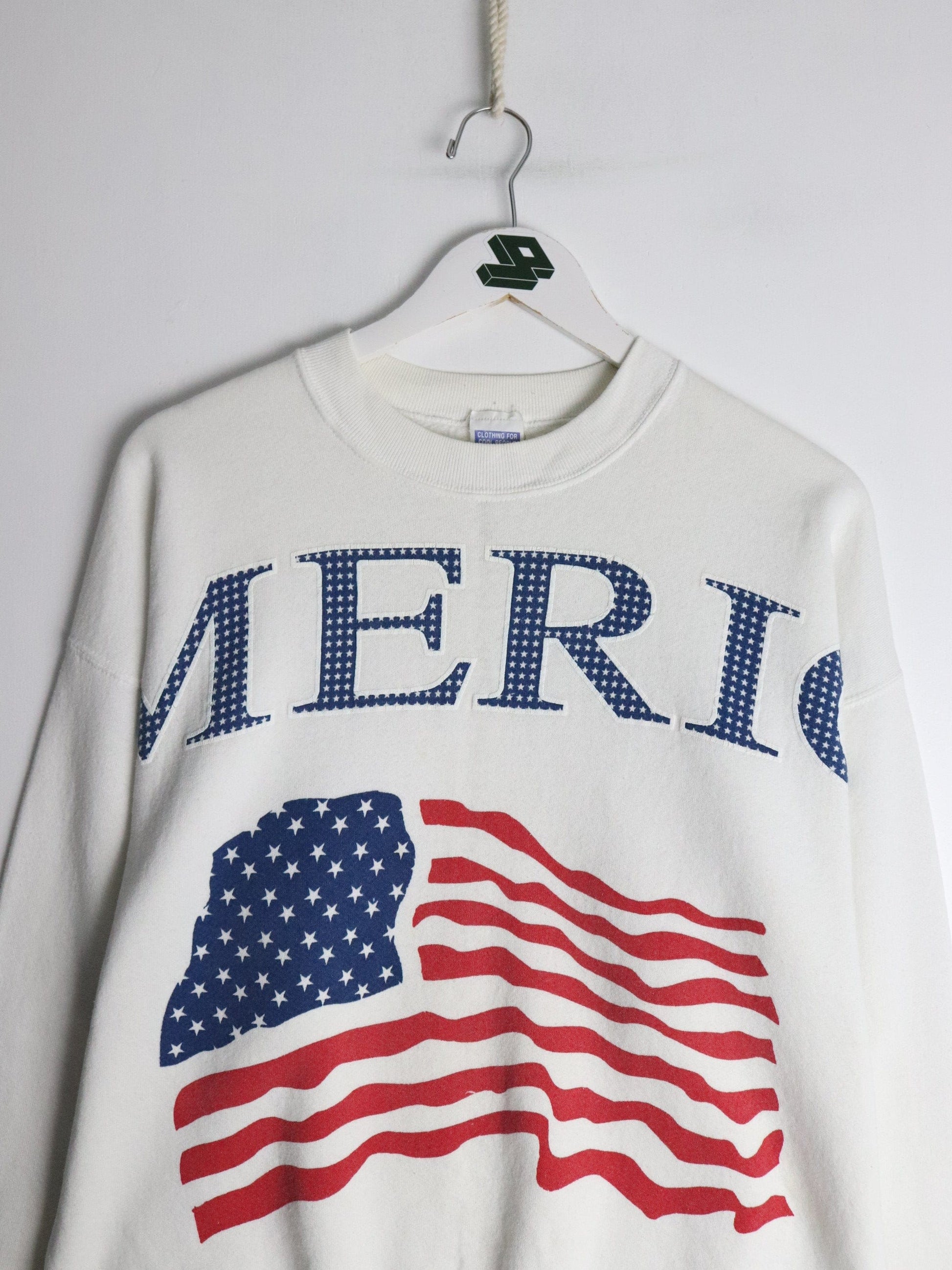 Vintage U.S.A. Flag Sweatshirt Fits Mens Medium White 90s from propervintagecanada