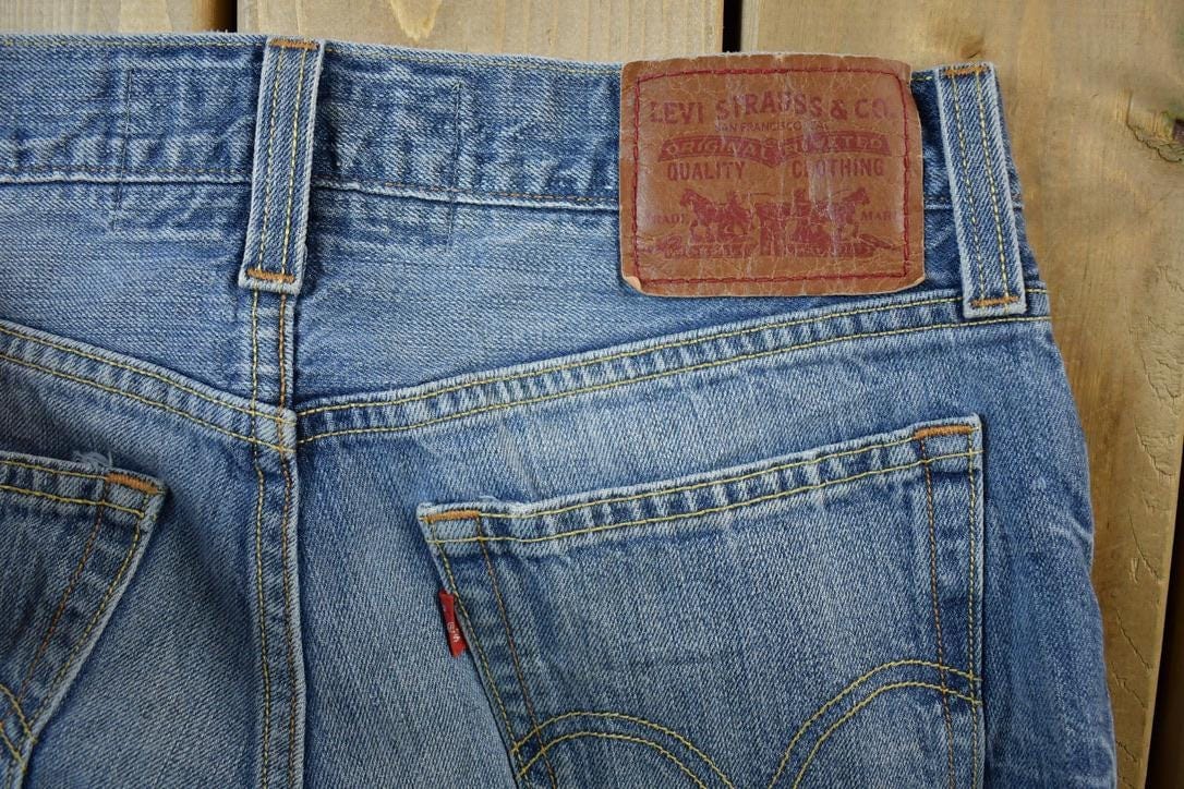 Vintage Y2K Levi Strauss Low Boot Cut Red Tab Denim Jeans Women's 24 x 30 from propervintagecanada