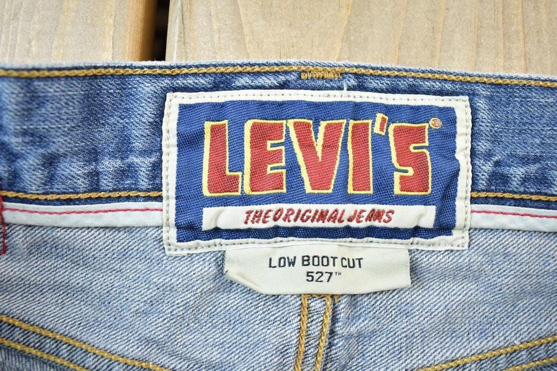 Vintage Y2K Levi Strauss Low Boot Cut Red Tab Denim Jeans Women's 24 x 30 from propervintagecanada