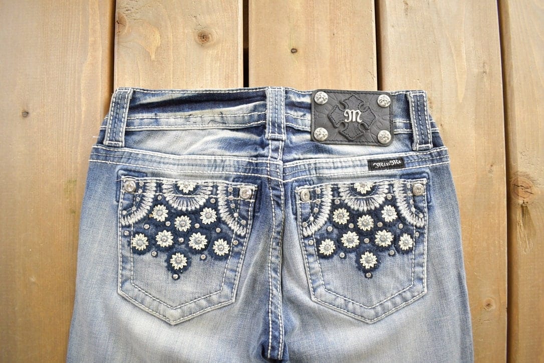 Vintage Y2K Miss Me Bedazzled Embroidered Faded Low Rise Boot Cut Low Rise Jeans Size 26x33 from propervintagecanada