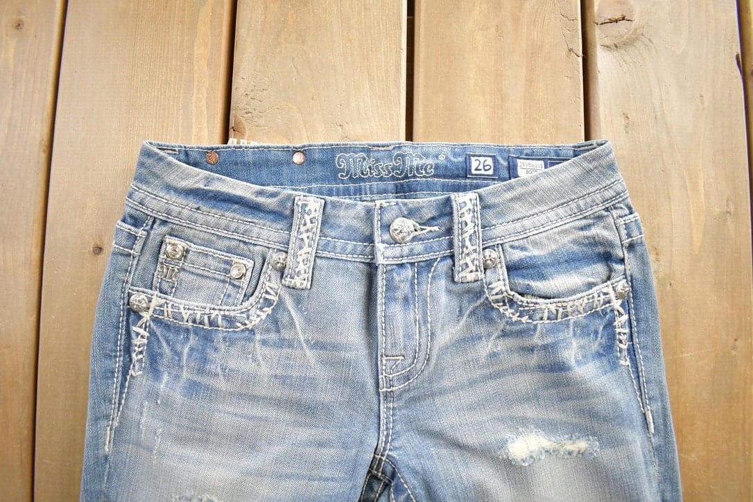 Vintage Y2K Miss Me Bedazzled Embroidered Thrashed Low Rise Boot Cut Low Rise Jeans Size 26x33 from propervintagecanada