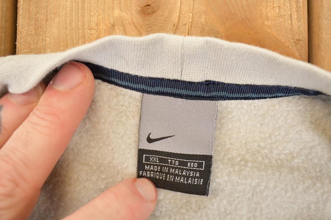 Vintage Y2K Nike Embroidered Mini Swoosh Sweatshirt Men's XL from propervintagecanada