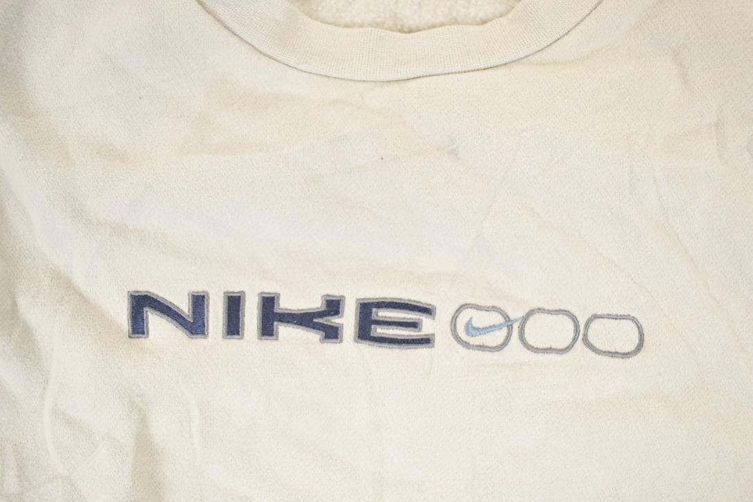 Vintage Y2K Nike Embroidered Mini Swoosh Sweatshirt Men's XL from propervintagecanada