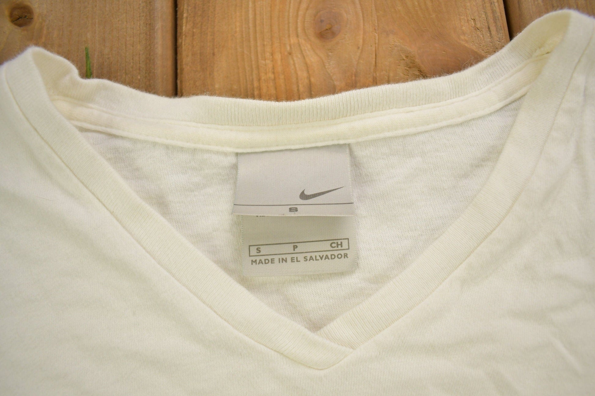 Vintage Y2K Nike Long Sleeve Graphic V-Neck T-Shirt Men's XS from propervintagecanada