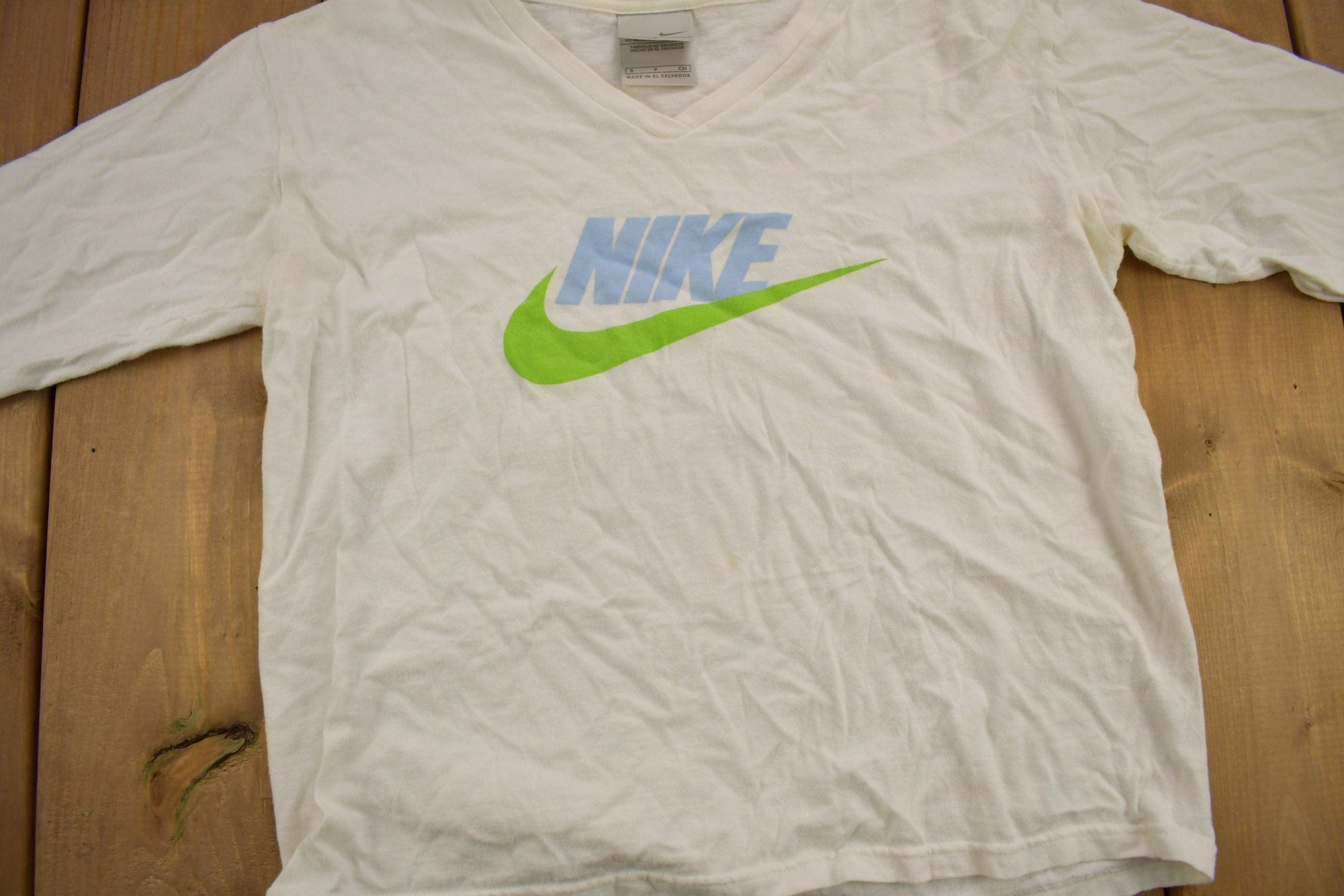 Vintage Y2K Nike Long Sleeve Graphic V-Neck T-Shirt Men's XS from propervintagecanada