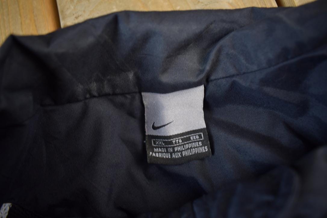 Vintage Y2K Nike Mini Swoosh Zip Up Windbreaker Jacket Men's 2XL from propervintagecanada