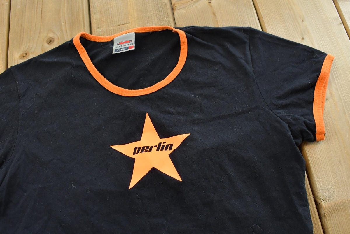 Vintage Y2K Sonar Peggy Berlin Star Ringer T Shirt Women's Medium from propervintagecanada