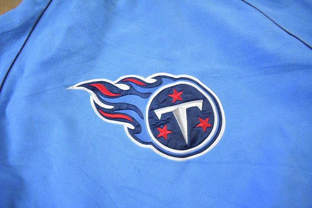Vintage Y2K Tennessee Titans NFL Reversible Fleece Football Jacket Men's 2XL from propervintagecanada